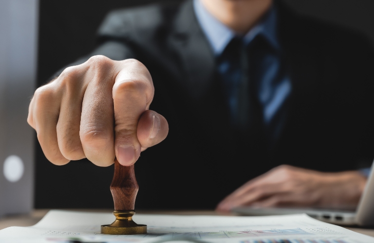 Lawyer is putting stamp on the document